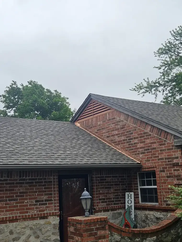 Completed architectural shingle roof on a brick and stone ranch — Bartlesville Roofing & Gutters, Bartlesville OK