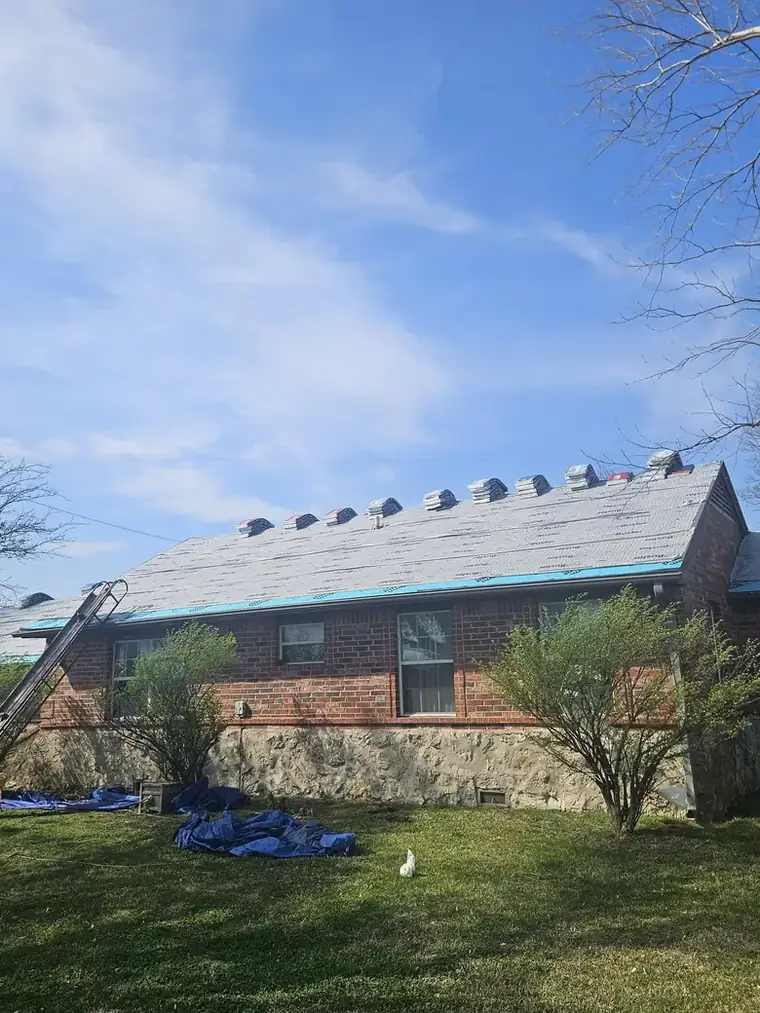 Dried in: synthetic underlayment down, drip edge taped, bundles staged on the ridge — Bartlesville Roofing & Gutters, Bartlesville OK